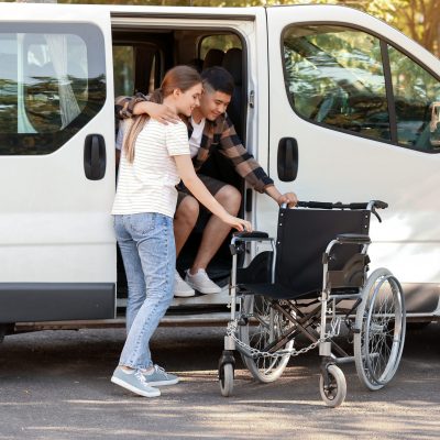 Woman,Helping,Her,Handicapped,Husband,To,Get,Out,Of,Van